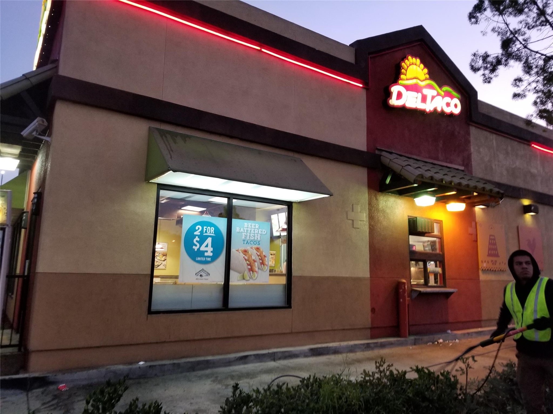 Restaurant exterior power washing performed at night to avoid business disruption