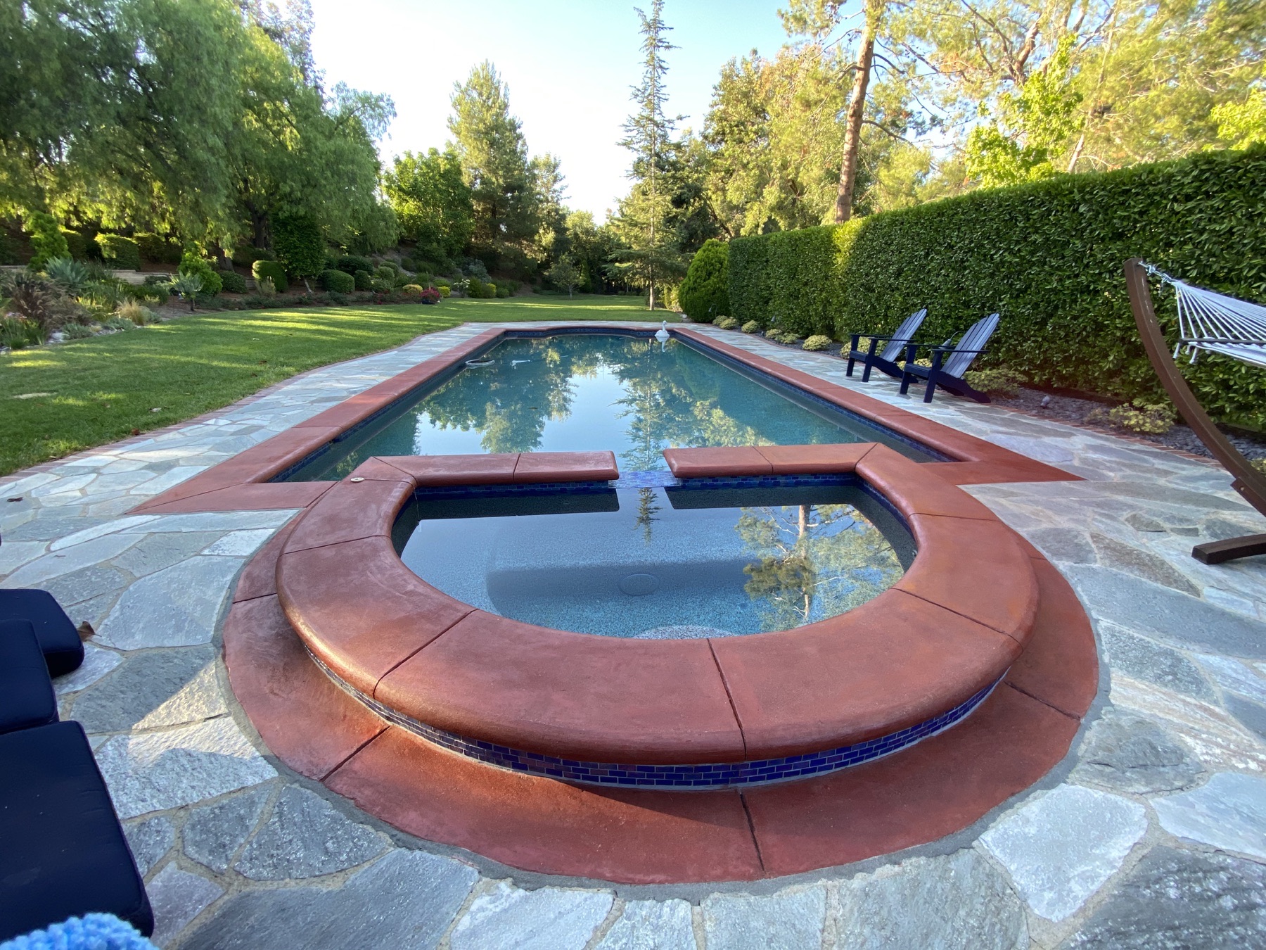 Completed stone pool deck and spa hardscape cleaning project